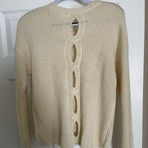 Lightweight sweater with back details.